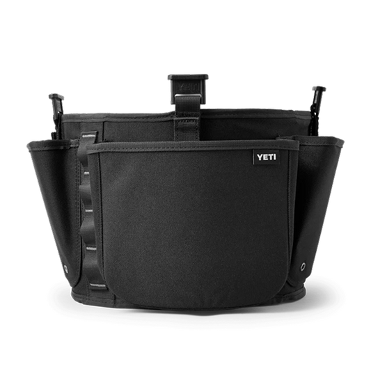 A black YETI waist bag with multiple utility pockets, side straps, and a front pocket featuring the white YETI logo.